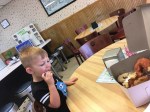 little boy eating&nbsp;donut